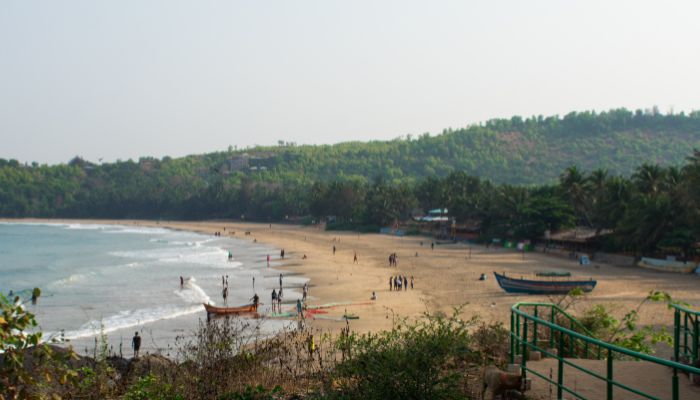 Image of Kudle Beach: A serene coastline with golden sands and crystal-clear waters under a blue sky