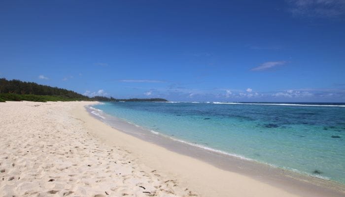 La Cambuse in Mauritius, a haven for swimming, showcasing a secluded beach with inviting turquoise waters and golden sands