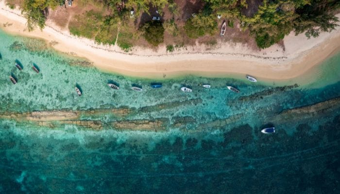 La Cuvette Beach in Mauritius, a serene nature spot with a beautiful beach, lush greenery, and calm waters