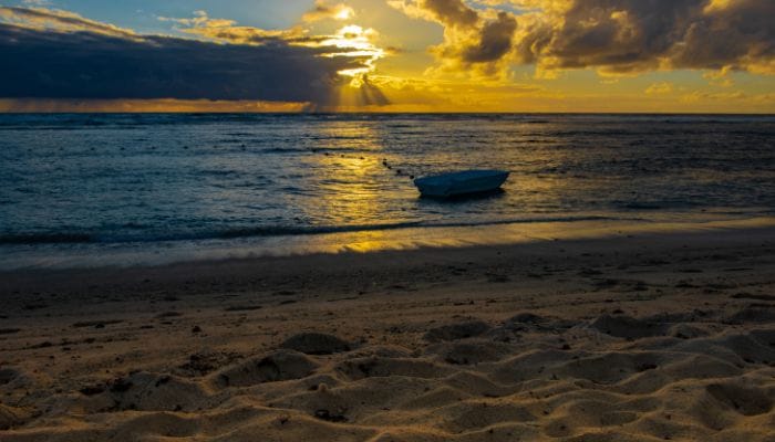 Poste Lafayette Beach in Mauritius, a hub of activities, showcasing a beautiful beach with people engaged in various leisure pursuits