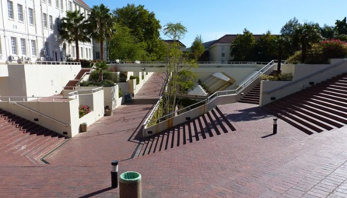 Stellenbosch University: A prestigious academic institution adorned with historic architecture, bustling campuses, and a vibrant academic atmosphere