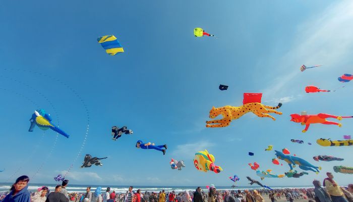 Colorful kites fill the sky at the International Kite Festival in Gujarat, India, as people gather to celebrate Uttarayan