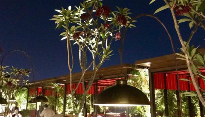 A couple enjoying a rooftop dining experience with a panoramic view at KDK’s Sky Dine in Vadodara.