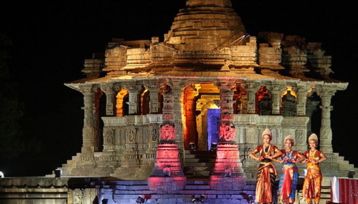 Traditional dancers perform at the Modhera Dance Festival against the backdrop of the ancient Sun Temple in Gujarat, India