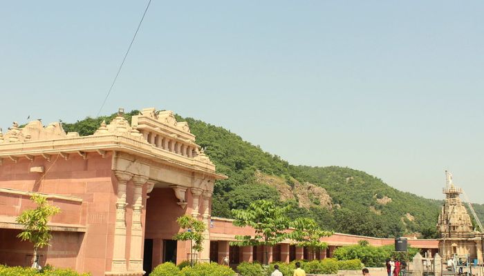 A vibrant scene from the Shamlaji Melo in Gujarat, with pilgrims in traditional attire, festive decorations, and activities around the historic Shamlaji Temple.