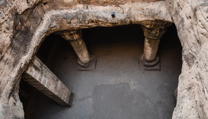 Ancient Buddhist Caves with stone pillars and carvings