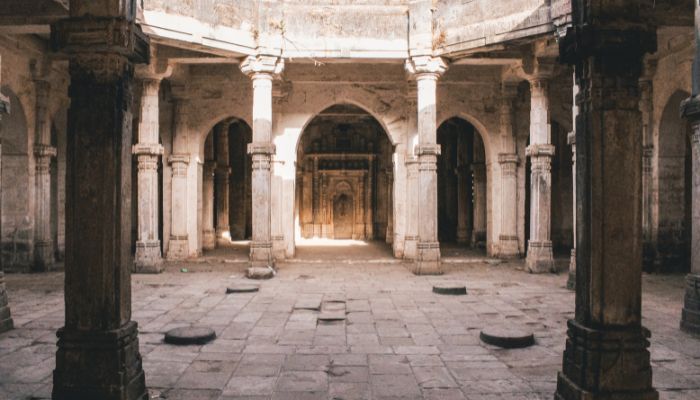 Interior of Uperkot Fort with ancient stone pillars and arches