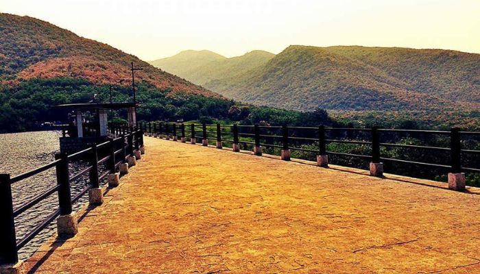 Scenic view of Willingdon Dam with mountains in the background